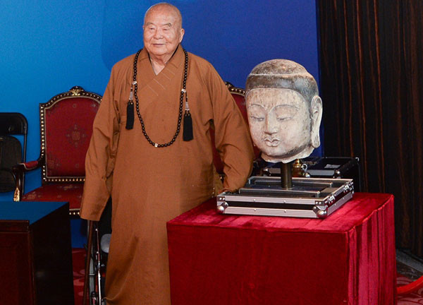 Retour d’ une ancienne tête de bouddha exposée au Musée national de Chine