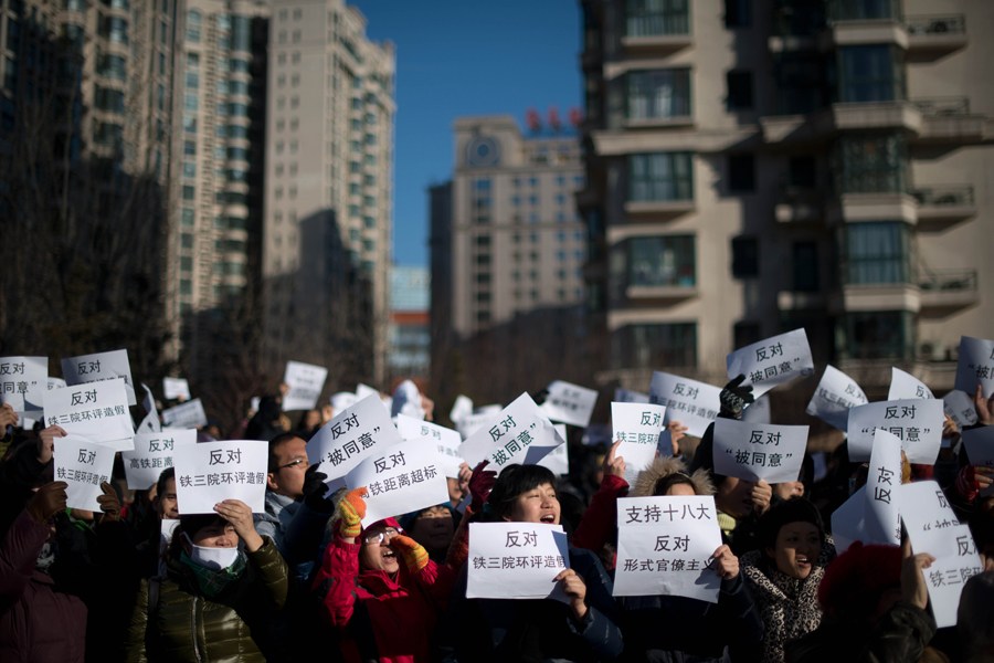 Des manifestants contre une fraude de l'EIE du TGV Beijing – Shenyang