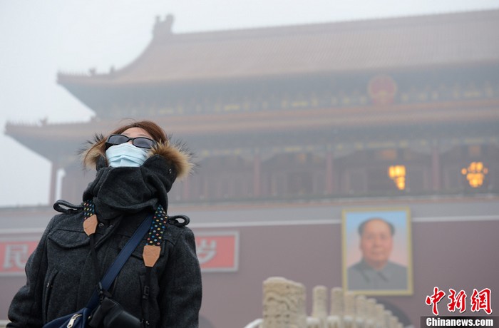 En images : l'épais brouillard recouvre la ville de Beijing