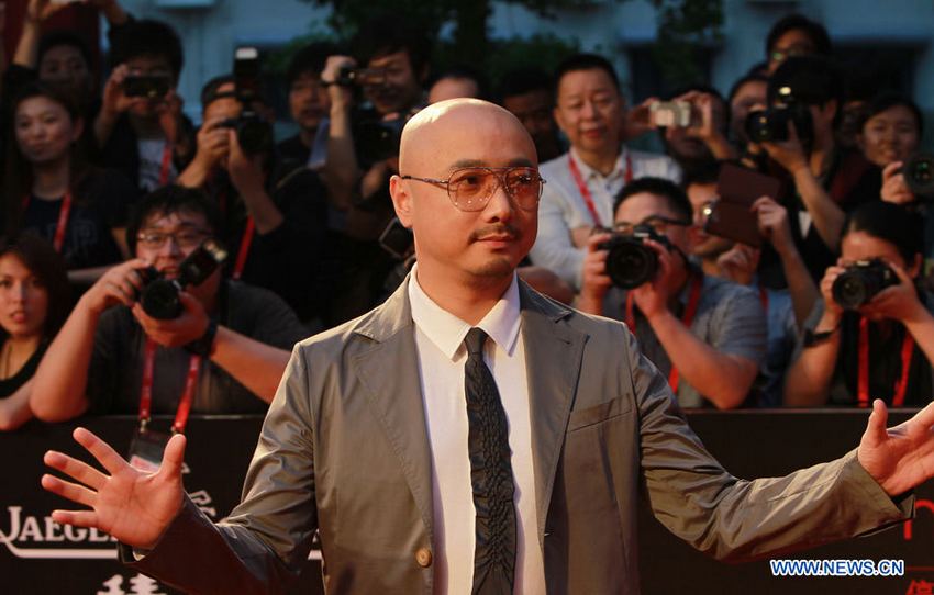 L'acteur et réalisateur chinois Xu Zheng sur le tapis rouge de la cérémonie d'ouverture du 16e Festival international du film de Shanghai, le 15 juin 2013