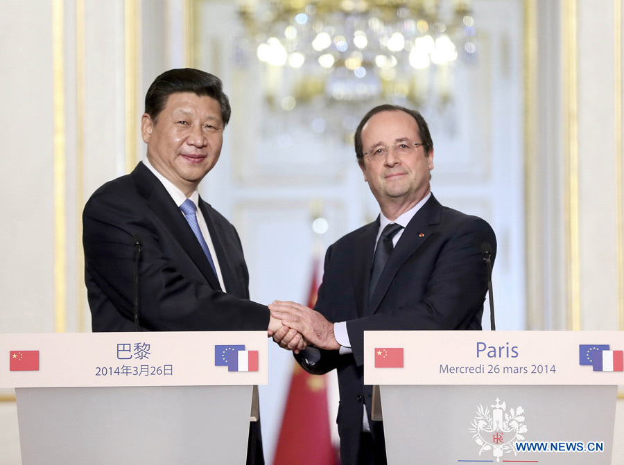 Le président chinois Xi Jinping et son homologue français François Hollande s'entretiennent le 26 mars 2014 à Paris sur l'avenir des relations entre les deux pays.