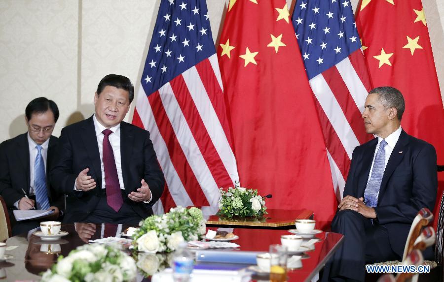 Le président chinois Xi Jinping rencontre à La Haye son homologue américain Barack Obama, avant le sommet sur la sécurité nucléaire, le 24 mars 2014.